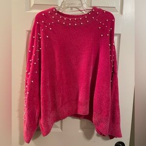 Hot pink chenille sweater with pearl accents.